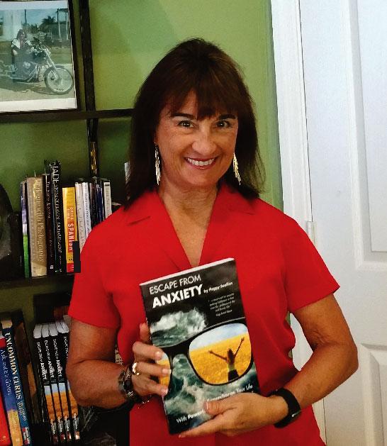 Photo of author holding book